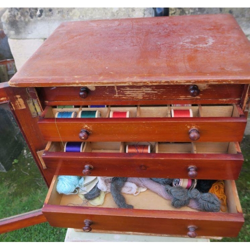 13 - A table top set of drawers, having a glazed door, with six drawers, 15ins x 10.25ins, height 18ins