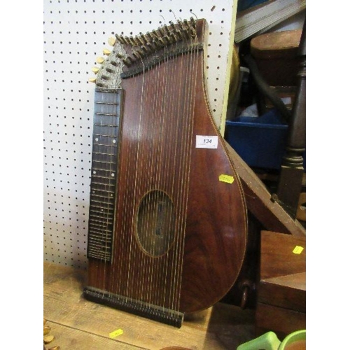 134 - Emabuel Kretschmar, a rosewood zither, together with a small guitar with label, By His Majesty's Roy... 