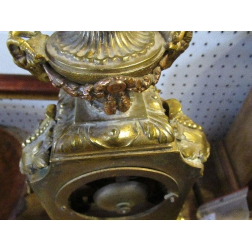 144 - A gilt metal and porcelain mantel clock, the porcelain panels decorated with cherubs and flowers, he... 