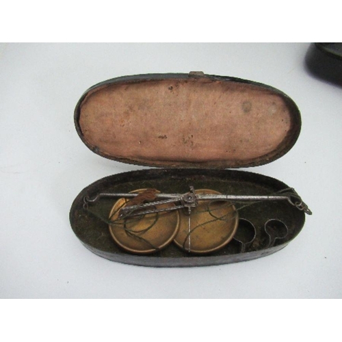 158 - A papier-mâché oblong shaped box, width 4.5ins, together with a set of encased travelling scales in ... 