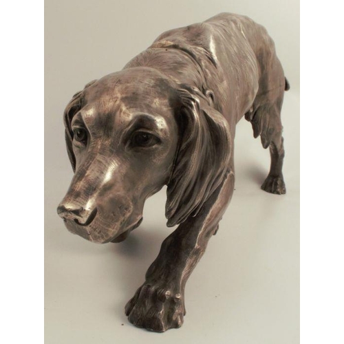 167 - A Continental white metal model, of a dog, eagle stamp to one foot, height 9.5ins, length 24.5ins