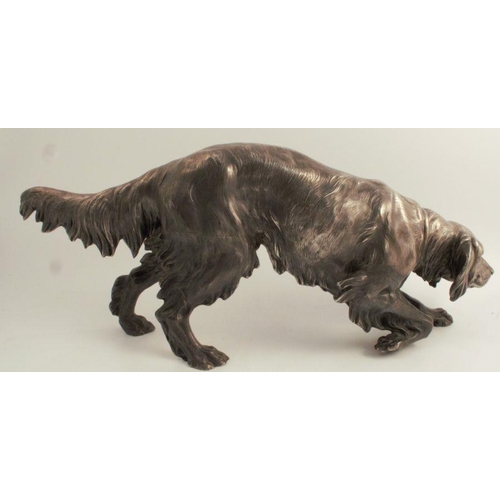 167 - A Continental white metal model, of a dog, eagle stamp to one foot, height 9.5ins, length 24.5ins