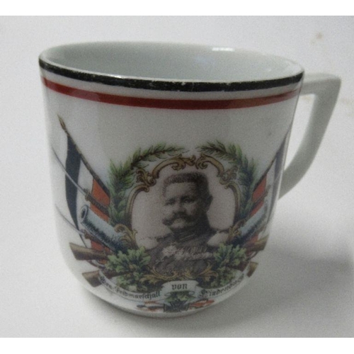 181 - Three items of commemorative ware, a plate and cup relating to Lord Kitchener, plate diameter 7ins, ... 