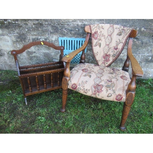 2 - An oak open arm chair, together with a magazine rack