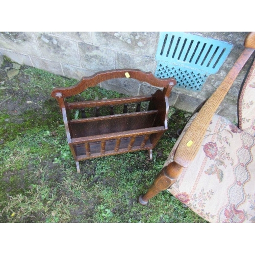 2 - An oak open arm chair, together with a magazine rack