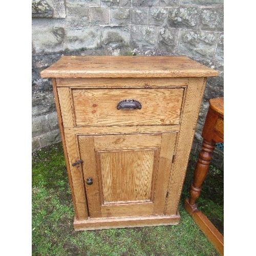 25 - A pine cabinet, having cupboard door below a drawer, width 27ins x depth 14ins x height 39ins, toget... 