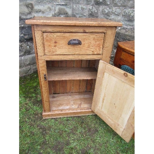 25 - A pine cabinet, having cupboard door below a drawer, width 27ins x depth 14ins x height 39ins, toget... 