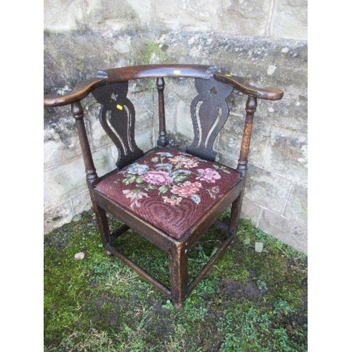 39 - An Antique oak corner chair, with pierced splats