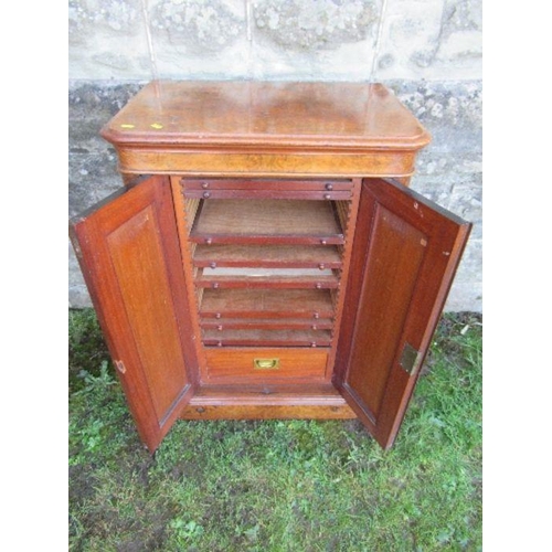 46 - A Victorian burr walnut specimen cabinet, the doors opening to reveal eight adjustable trays over a ... 