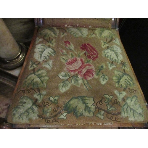 53 - A Victorian carved chair, with tapestry seat and back