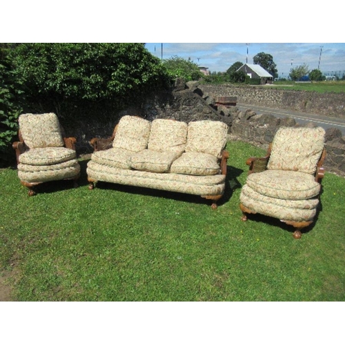 57 - A walnut framed bergere suite, comprising a three seat sofa width 67ins x height 31ins, and two sing... 