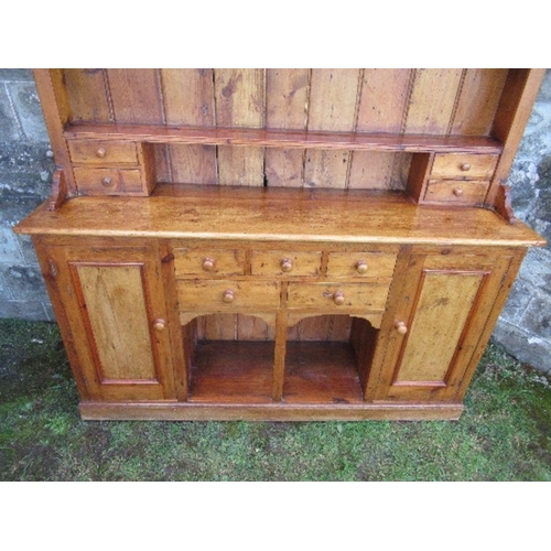 6 - A pine dresser, with arcaded upper section, width 70ins x depth 16ins x height 84ins