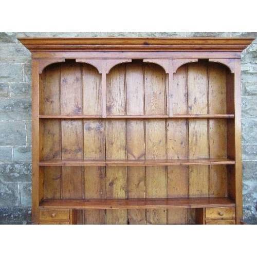 6 - A pine dresser, with arcaded upper section, width 70ins x depth 16ins x height 84ins