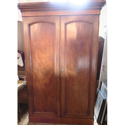 60 - A Victorian mahogany double door wardrobe, fitted with a hanging space and drawer to one side, with ... 