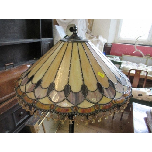 68 - A metal lamp standard, with Tiffany style leaded glass shade, height 62ins