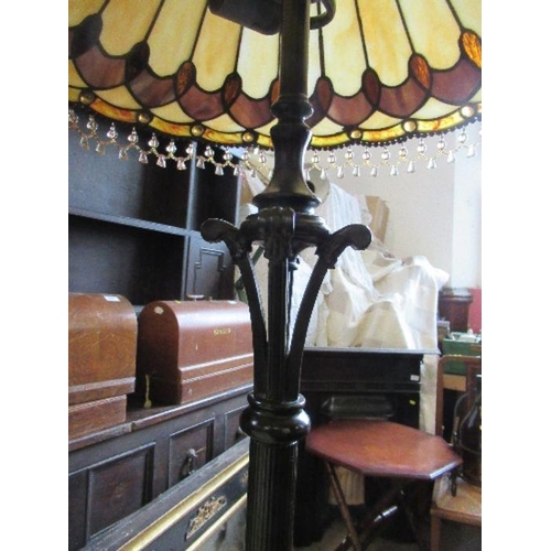 68 - A metal lamp standard, with Tiffany style leaded glass shade, height 62ins