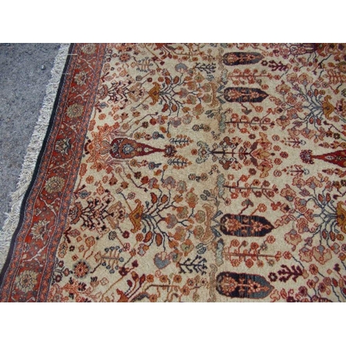 75 - An Eastern design rug, decorated with foliage, 66ins x 93ins