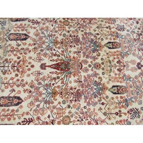 75 - An Eastern design rug, decorated with foliage, 66ins x 93ins