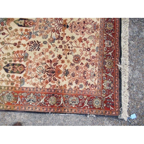 75 - An Eastern design rug, decorated with foliage, 66ins x 93ins