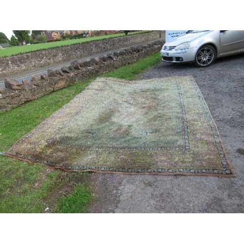 76 - A large Eastern design rug, decorated with animals hunting with foliage, 2 inch hole, 103ins x 145in... 