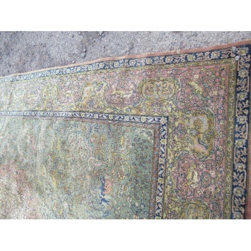 76 - A large Eastern design rug, decorated with animals hunting with foliage, 2 inch hole, 103ins x 145in... 