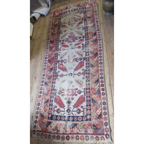 79 - An Eastern design runner, af, 104ins x 40ins, together with a red ground mat, 37ins x 24ins