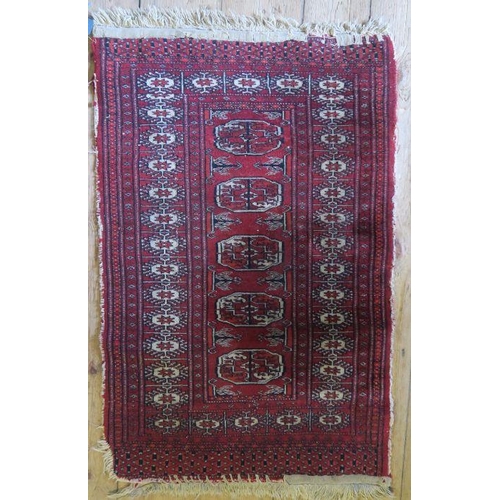 79 - An Eastern design runner, af, 104ins x 40ins, together with a red ground mat, 37ins x 24ins