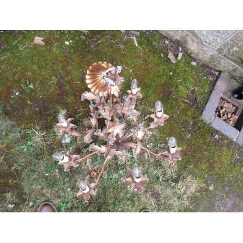 93 - A gilt metal chandelier light fitting, with leaf decoration and facetted clear droppers, height 27in... 