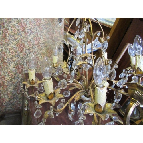 93 - A gilt metal chandelier light fitting, with leaf decoration and facetted clear droppers, height 27in... 