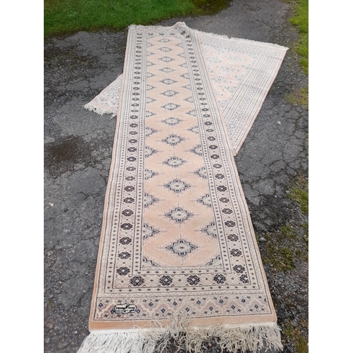 78 - An Eastern design runner, 32ins x 126ins, together with a similar Eastern rug, 50ins x 72ins