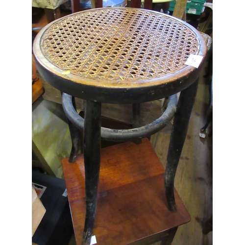 97 - A mahogany plant stand, a cane stool and a sewing box