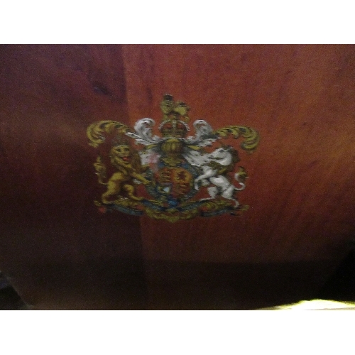 21 - A circular coffee table, together with a trunk, a magazine rack and a mahogany box with coat of arms... 