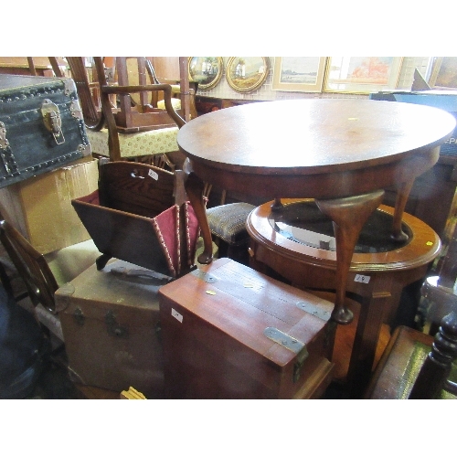 21 - A circular coffee table, together with a trunk, a magazine rack and a mahogany box with coat of arms... 