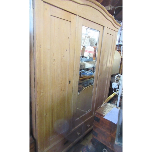 34 - A pine mirror door wardrobe, fitted with two drawers to the base, width 66ins, height 80ins