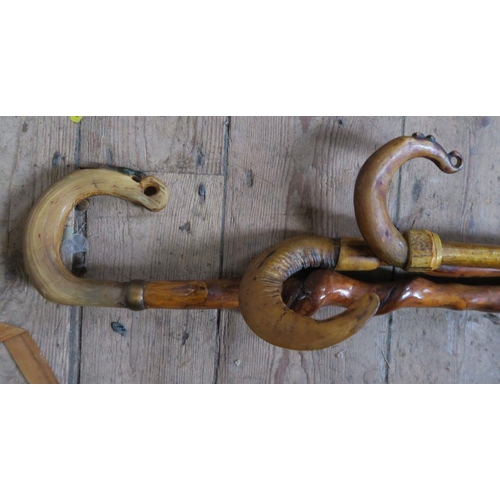 190 - Three horn handled walking sticks, two with twisted shafts