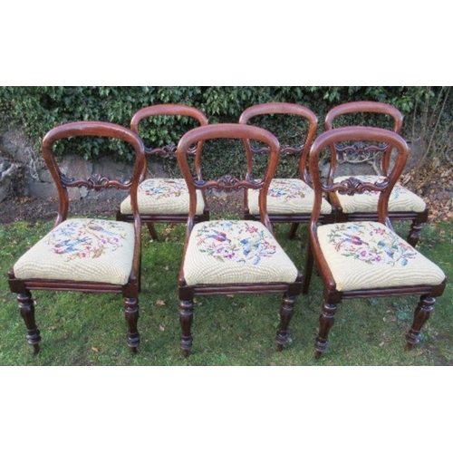 2 - A set of six Victorian mahogany dining chairs, raised on turned front legs, with tapestry seats