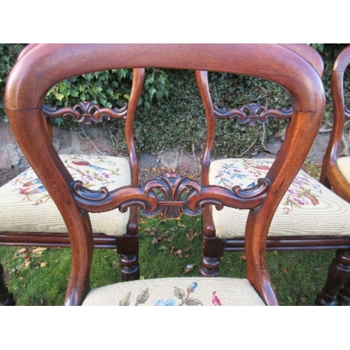 2 - A set of six Victorian mahogany dining chairs, raised on turned front legs, with tapestry seats