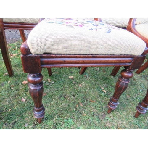 2 - A set of six Victorian mahogany dining chairs, raised on turned front legs, with tapestry seats