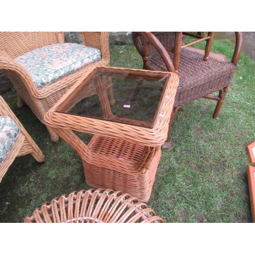 27 - A collection of cane furniture, to include three armchairs, glass top table, and a round table, toge... 