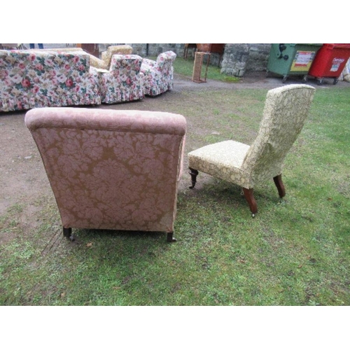 28 - A Howard style armchair, together with an easy chair