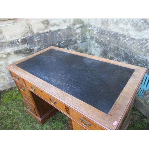 31 - An Edwardian twin pedestal desk, fitted with a central drawer flanked by two short drawers, having t... 