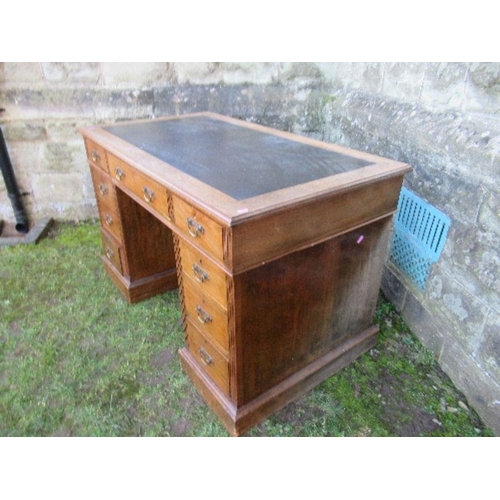 31 - An Edwardian twin pedestal desk, fitted with a central drawer flanked by two short drawers, having t... 