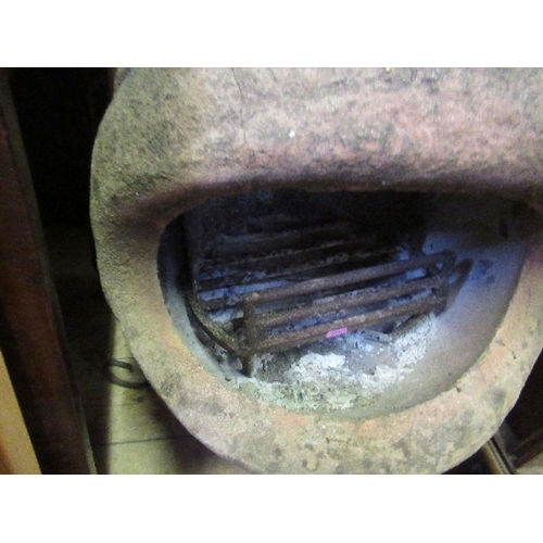 37 - A chimenea, raised on a metal stand, height 49ins