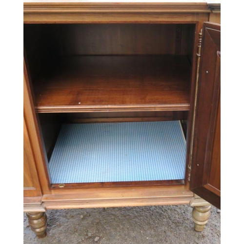 38 - A continental cupboard, with deep relief moulded panel door, raised on a turned legs, width 27.5ins ... 