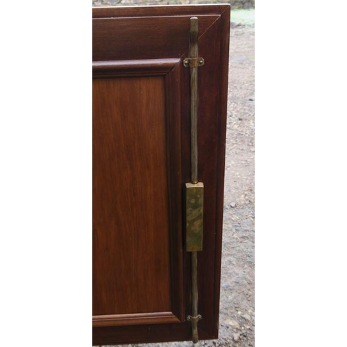 38 - A continental cupboard, with deep relief moulded panel door, raised on a turned legs, width 27.5ins ... 