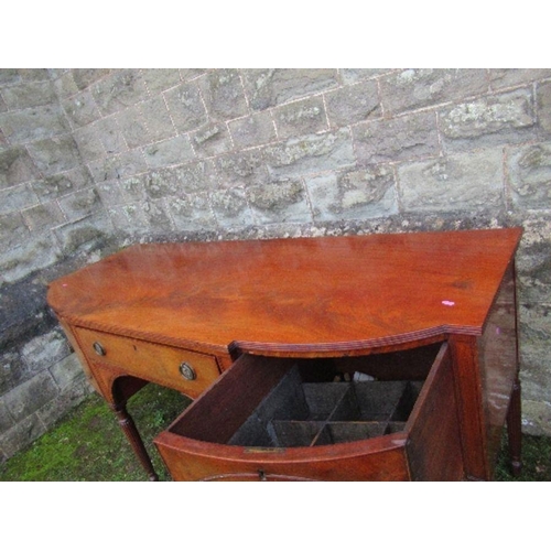 53 - A Regency mahogany bow front sideboard, fitted with a central drawer flanked by cupboard doors, open... 