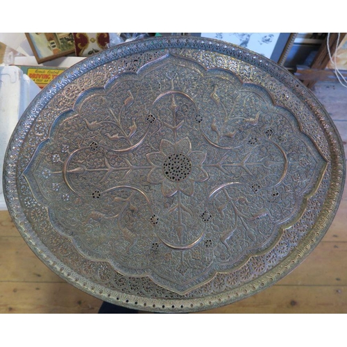 549 - An Eastern metal oval tray, with pierced and embossed decorations, maximum diameter 24.5ins