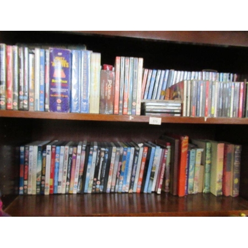 570 - Three shelves of assorted DVDs, CDs, books, and records