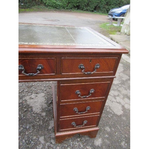 58 - A reproduction pedestal desk, with leather writing top, 47ins x 24ins x height 30.5ins