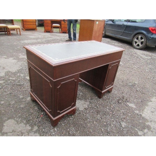 58 - A reproduction pedestal desk, with leather writing top, 47ins x 24ins x height 30.5ins